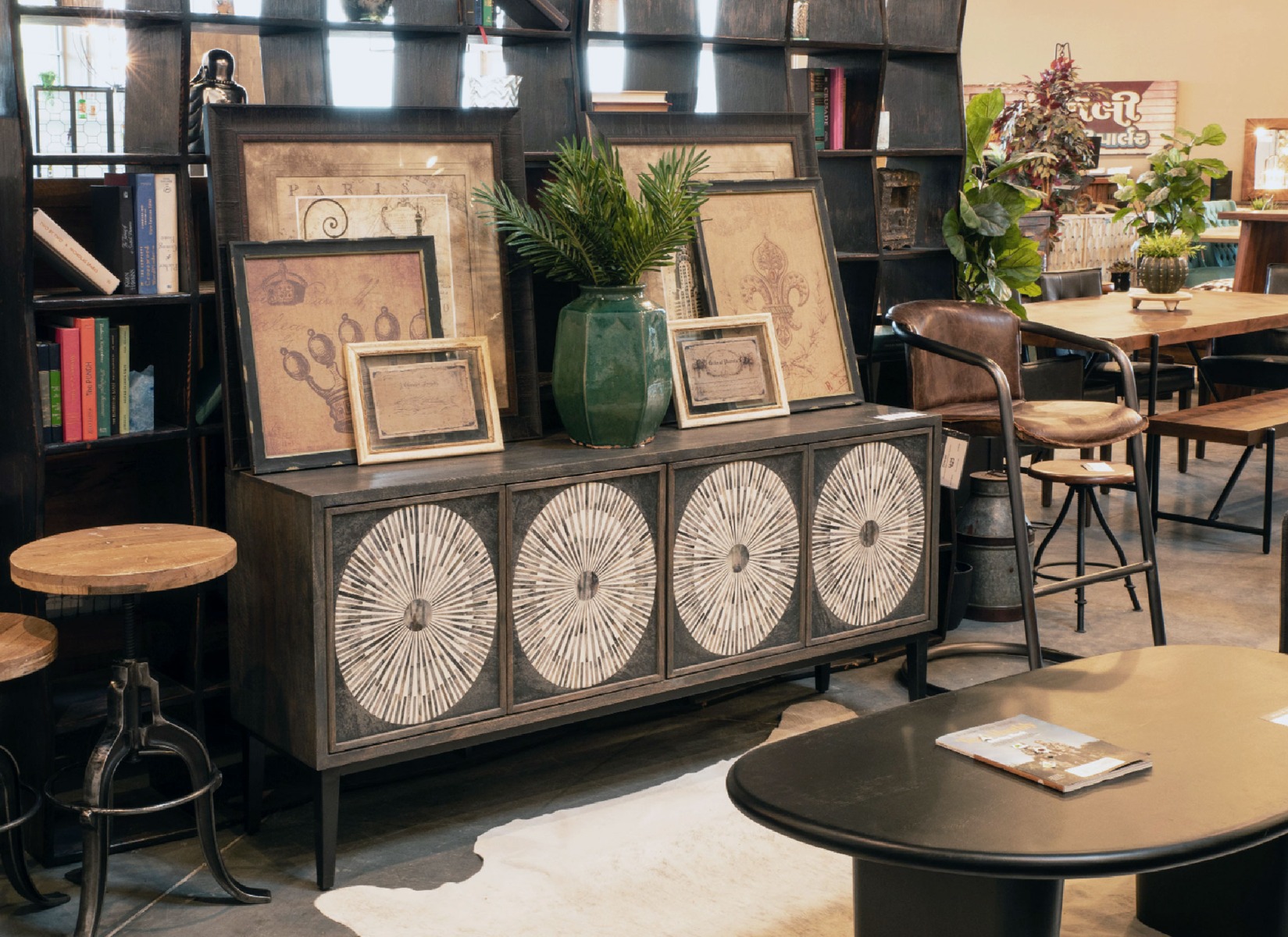 HTD Home Trends Design Austin Showroom featuring the Portofino Industrial Accent Chair in Antique Ebony leather.